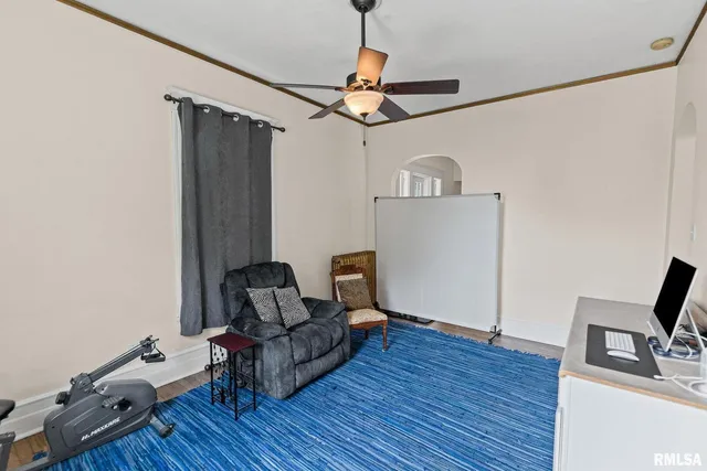 a view of a room with wooden floor