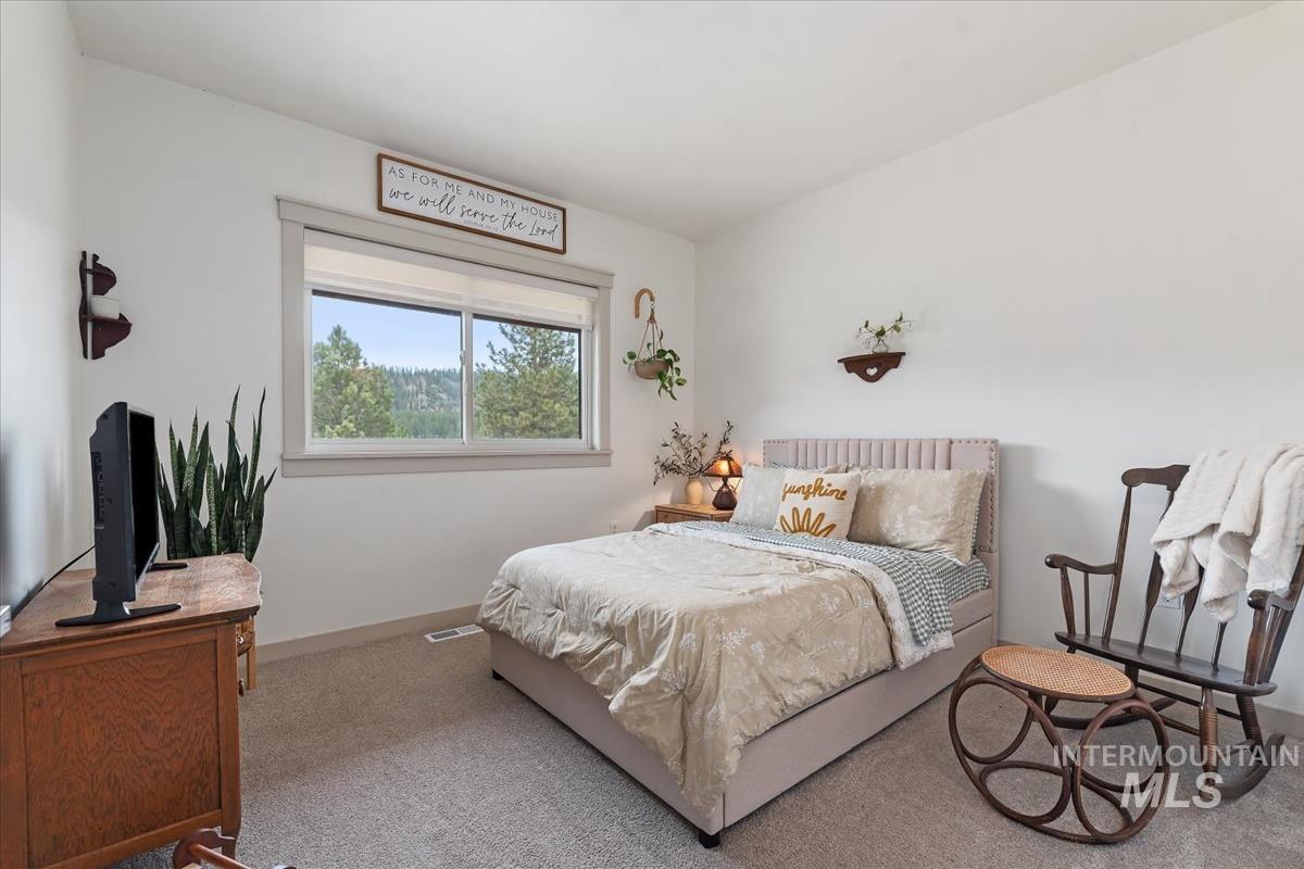 6 East Beck Road Garden Valley, ID 83622 - Photo 23 of 44 Carpeted bedroom featuring baseboards