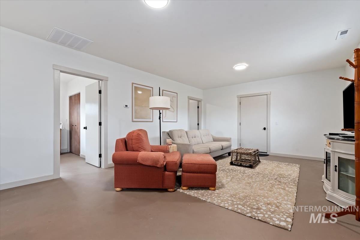 6 East Beck Road Garden Valley, ID 83622 - Photo 35 of 44 Living area with baseboards and concrete floors