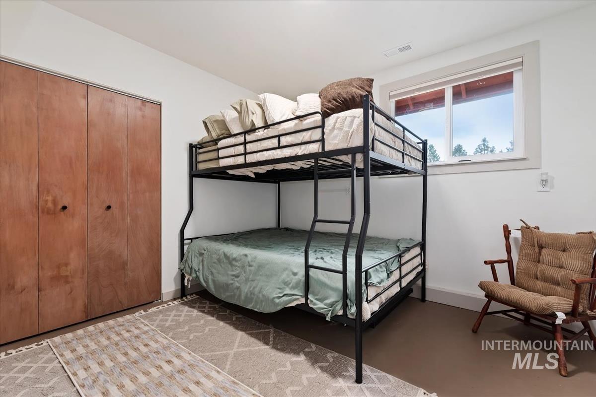 6 East Beck Road Garden Valley, ID 83622 - Photo 36 of 44 Bedroom with a closet and finished concrete floors