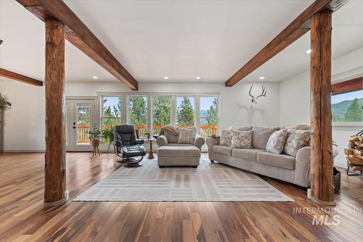 6 East Beck Road Garden Valley, ID 83622 - Photo 4 of 44 Living room with beamed ceiling, healthy amount of natural light, hardwood / wood-style floors, and recessed lighting