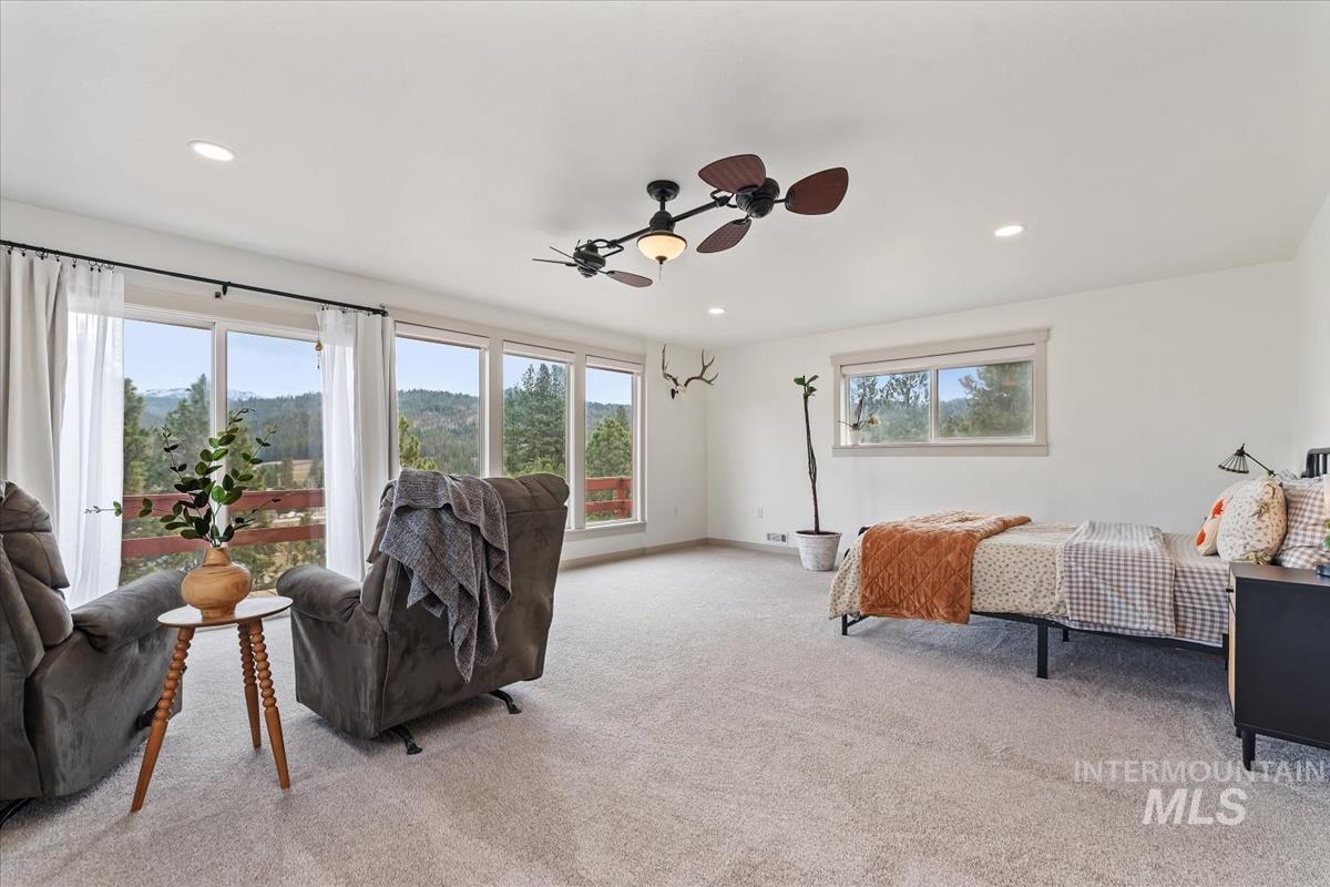 6 East Beck Road Garden Valley, ID 83622 - Photo 9 of 44 Bedroom with light colored carpet, ceiling fan, access to outside, and recessed lighting