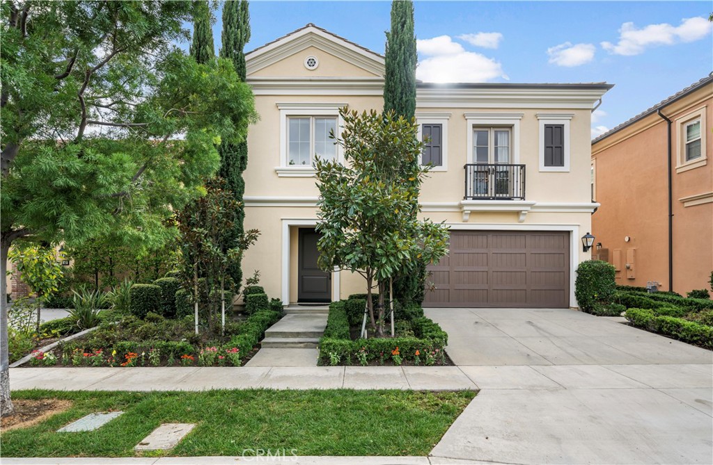 58 Elmdale Irvine, CA 92620 - Photo 5 of 5 a front view of a house with a yard and trees