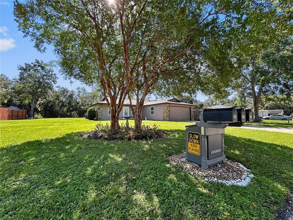 a view of a house with a back yard