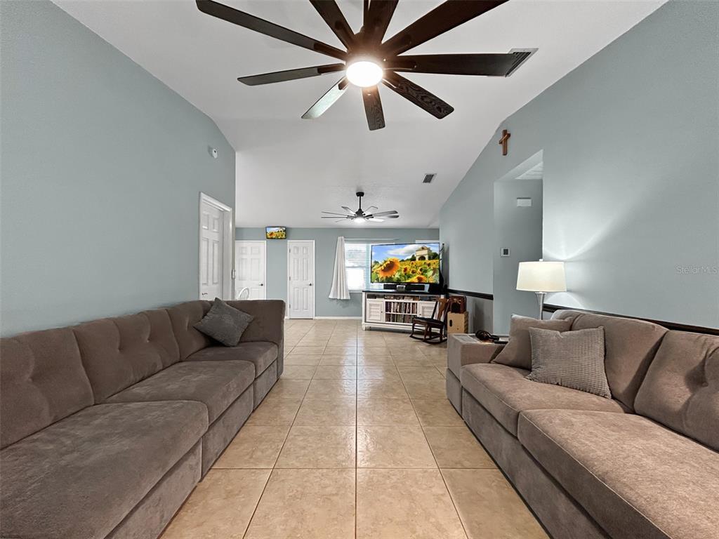 136 Paul Revere Road Bartow, FL 33830 - Photo 3 of 17 a living room with furniture and a flat screen tv