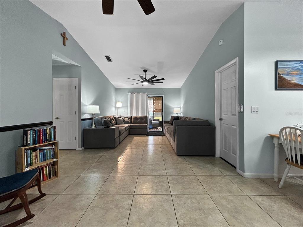136 Paul Revere Road Bartow, FL 33830 - Photo 5 of 17 a large room with lots of furniture and a book shelf