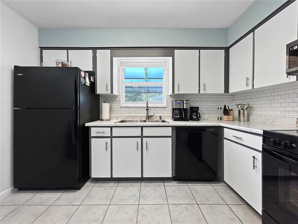136 Paul Revere Road Bartow, FL 33830 - Photo 6 of 17 a kitchen with a refrigerator and a sink
