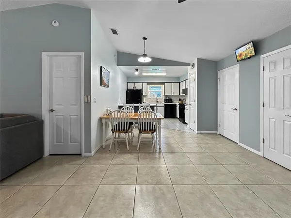 a bedroom with a bed a table and chair