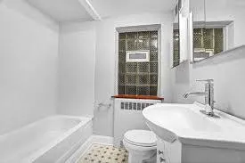 a bathroom with a sink toilet and bathtub