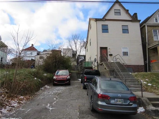 a car parked in front of a house