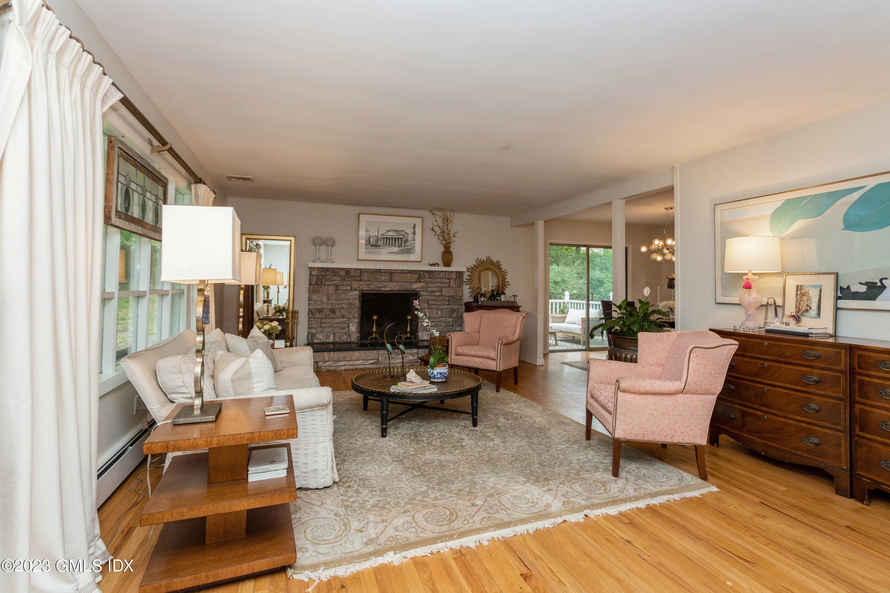 29 Dandy Drive Cos Cob, CT 06807 - Photo 2 of 17 a living room with furniture and a fireplace