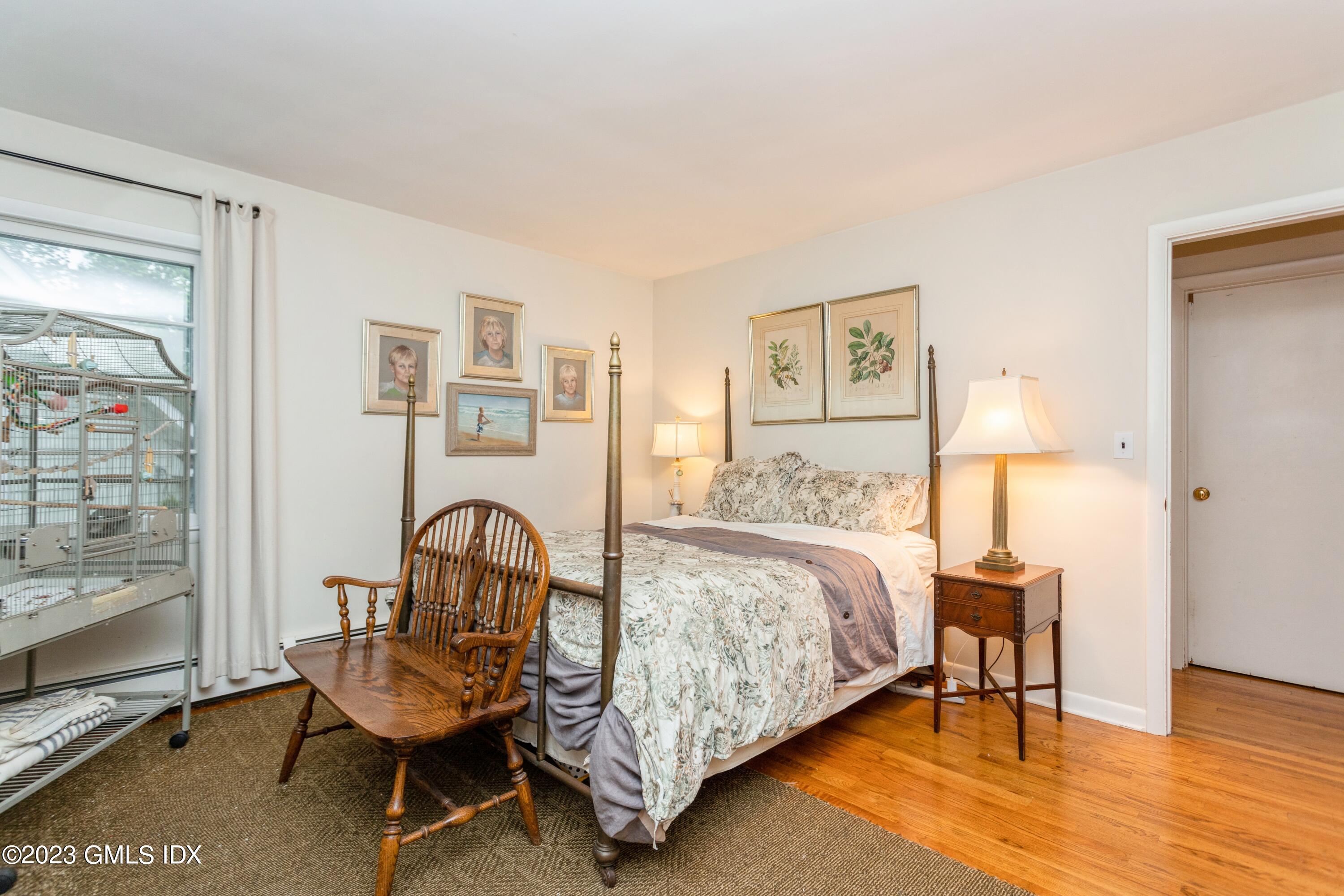 29 Dandy Drive Cos Cob, CT 06807 - Photo 6 of 17 a bedroom with bed and a table