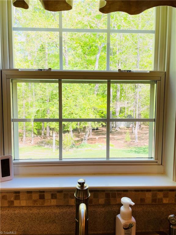 7818 Wilson Farm Road Summerfield, NC 27358 - Photo 14 of 50 kitchen window overlooks backyard