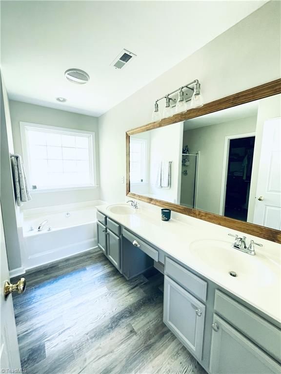 7818 Wilson Farm Road Summerfield, NC 27358 - Photo 22 of 50 Updated primary bathroom with new plank laminate floors