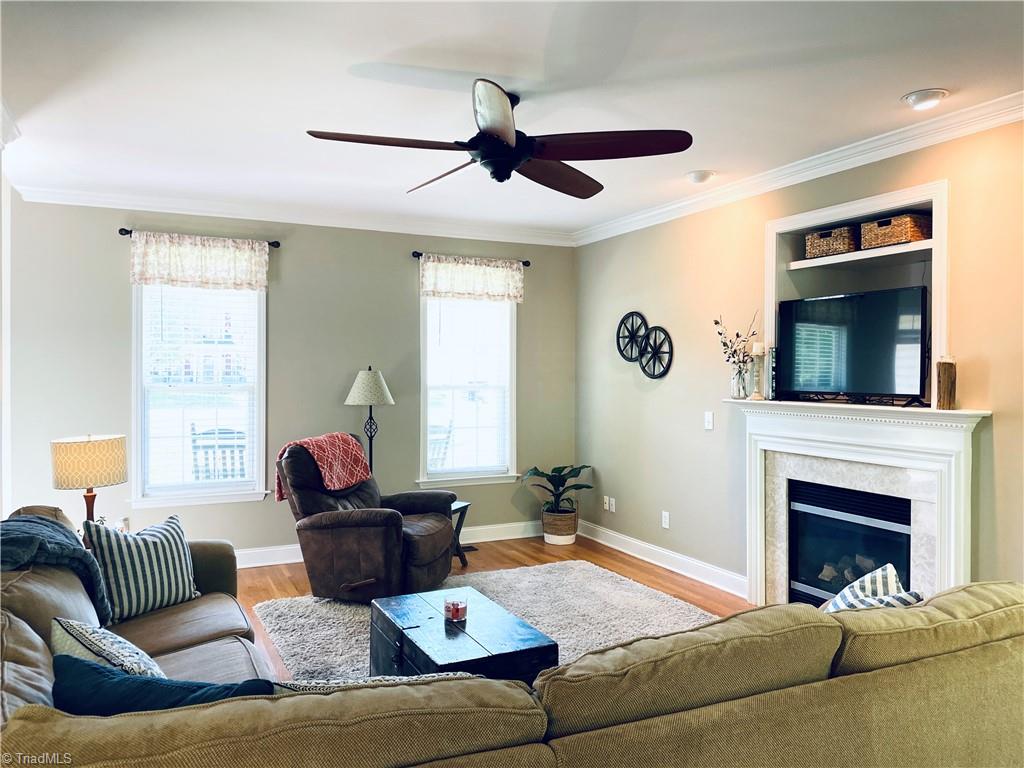 7818 Wilson Farm Road Summerfield, NC 27358 - Photo 48 of 50 Living room with fireplace gas logs