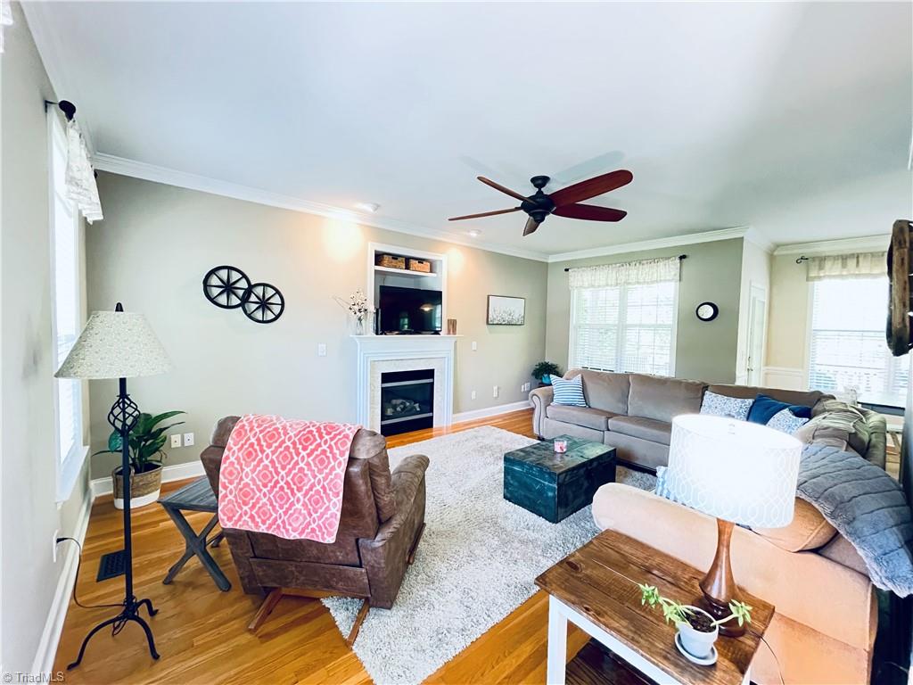 7818 Wilson Farm Road Summerfield, NC 27358 - Photo 50 of 50 Living room open to breakfast area and kitchen
