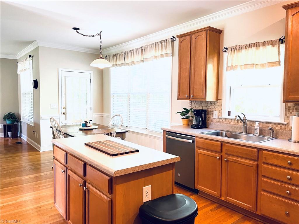 7818 Wilson Farm Road Summerfield, NC 27358 - Photo 9 of 50 Kitchen offers plenty of cabinet space and counter space, open to breakfast area