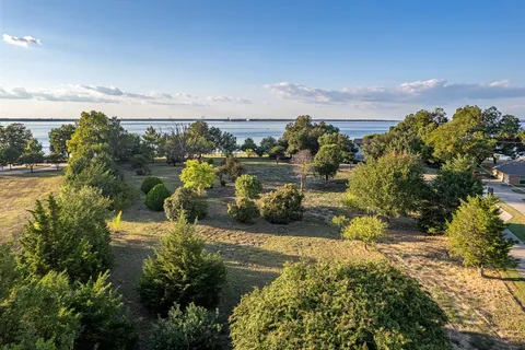 a view of a lake with a building in the background