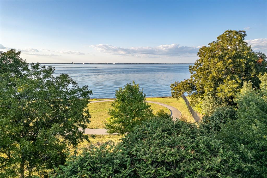 520 Terry Lane Heath, TX 75032 - Photo 15 of 28 a view of a lake with a building in the background