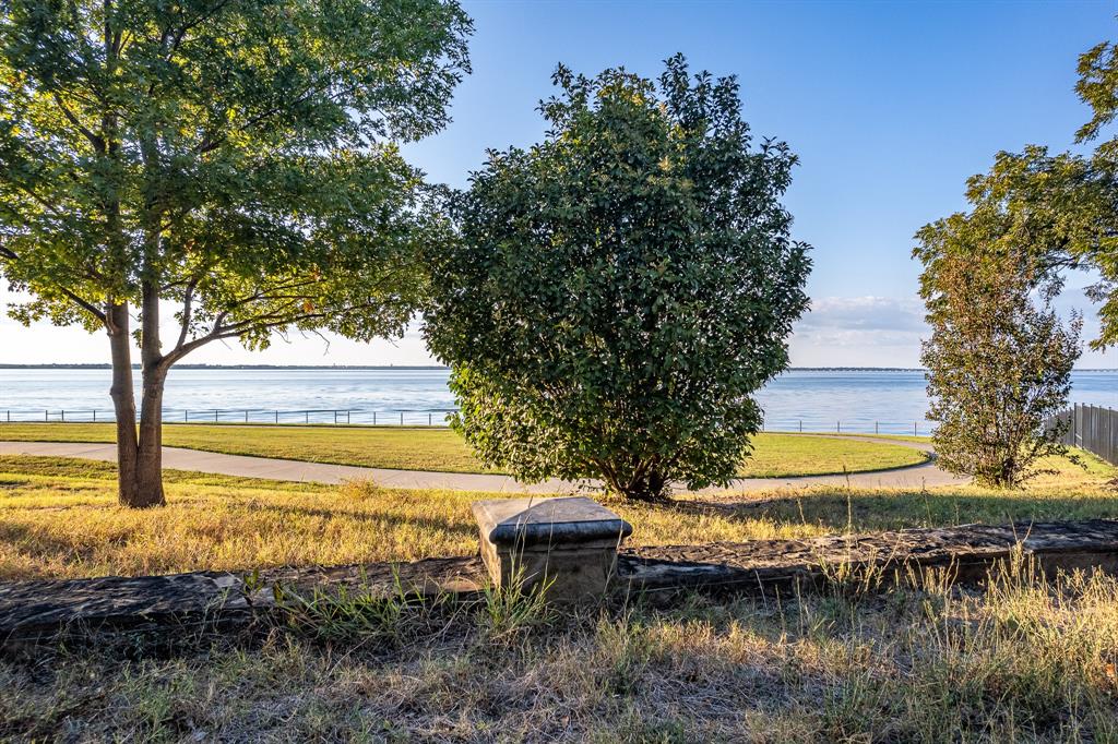 520 Terry Lane Heath, TX 75032 - Photo 16 of 28 a view of a lake with a big yard and large trees