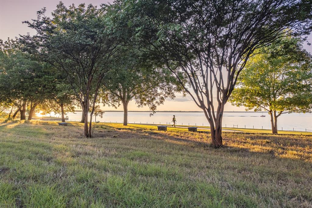 520 Terry Lane Heath, TX 75032 - Photo 24 of 28 a view of yard with trees in the background