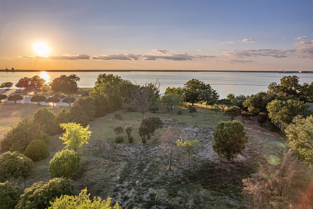 520 Terry Lane Heath, TX 75032 - Photo 25 of 28 a view of a lake with a mountain in the back