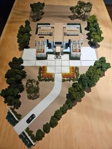 a front view of residential houses with yard