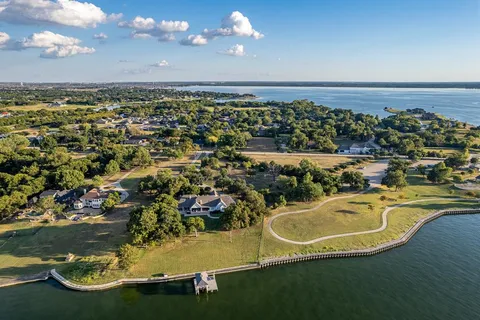 an aerial view of a house with a ocean view