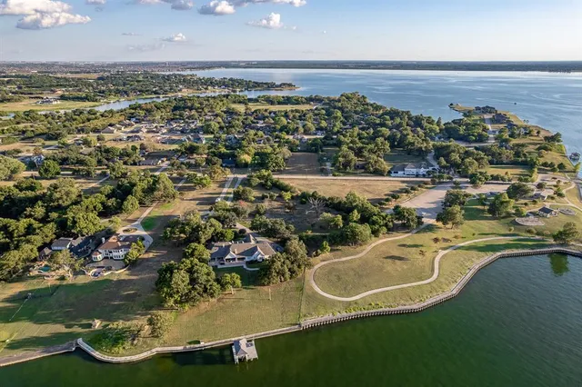 an aerial view of a house a yard basket ball court and outdoor seating