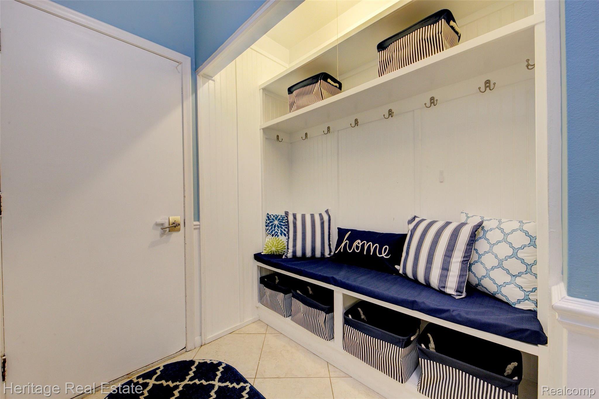 654 Old Perch Road Rochester, MI 48309 - Photo 29 of 61 Mud room area in the hallway leading to the garage features built in seating and storage