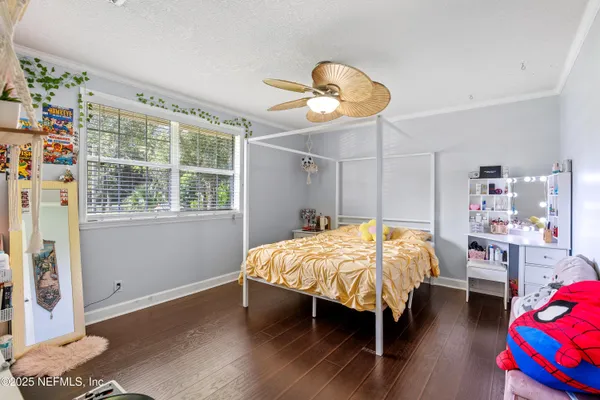a view of a a dining room with furniture window and wooden floor