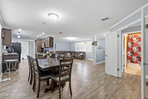 a kitchen with a sink cabinets and window