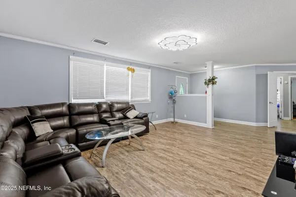 a bedroom with a bed and a couch