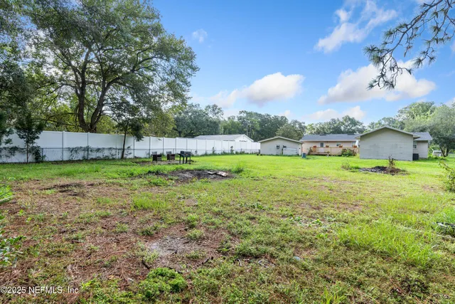 a patio with a table and chairs