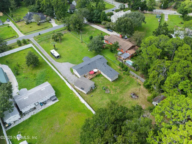 an aerial view of a house with outdoor space