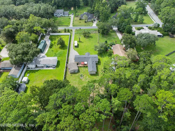 a view of a forest with a houses