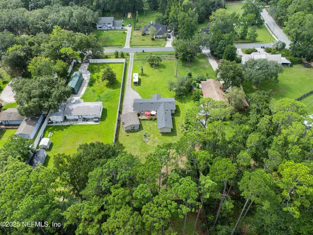 a view of a forest with a houses