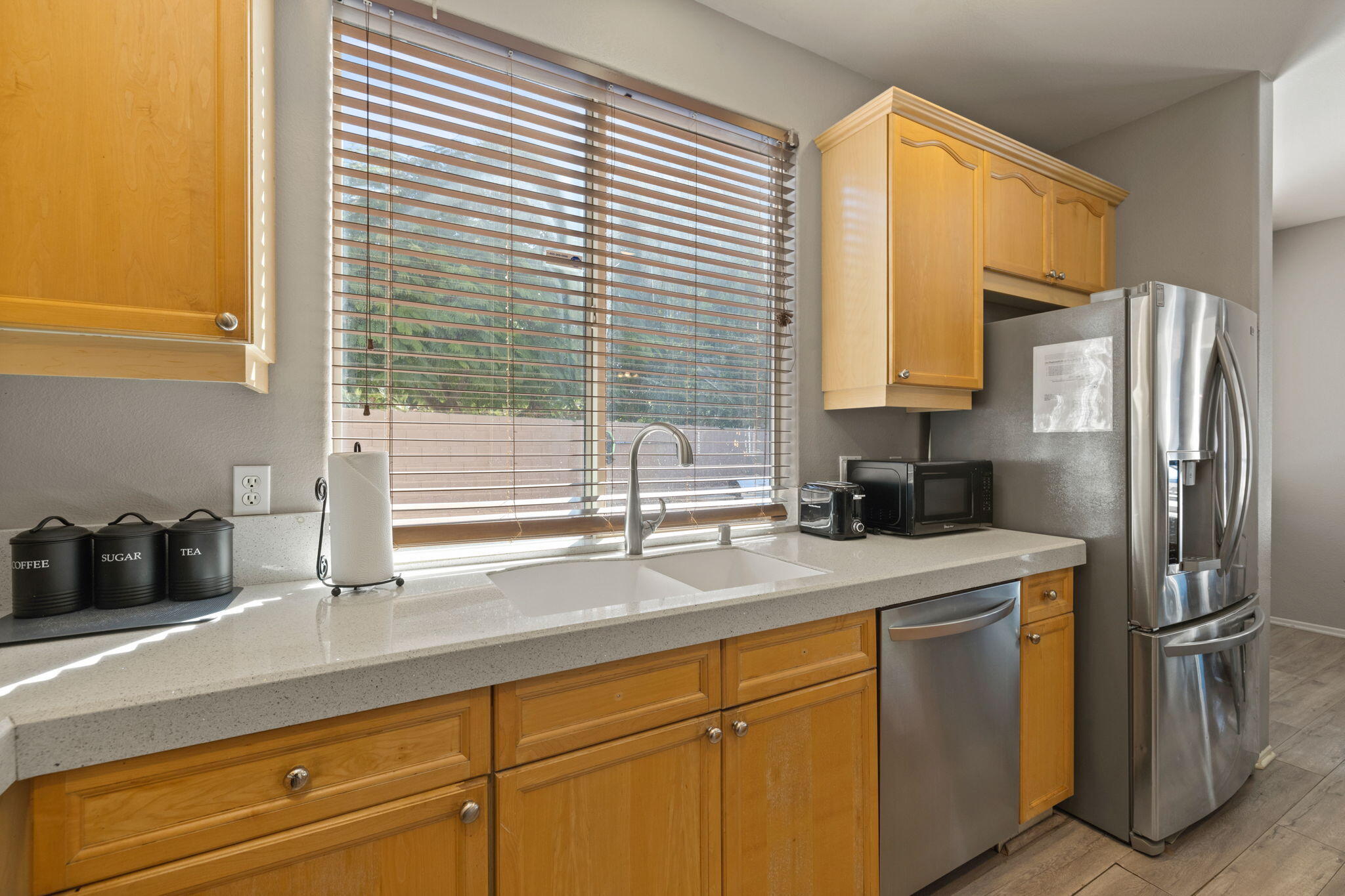 80759 Avery Drive Indio, CA 92201 - Photo 13 of 70 a kitchen with a sink a refrigerator and cabinets