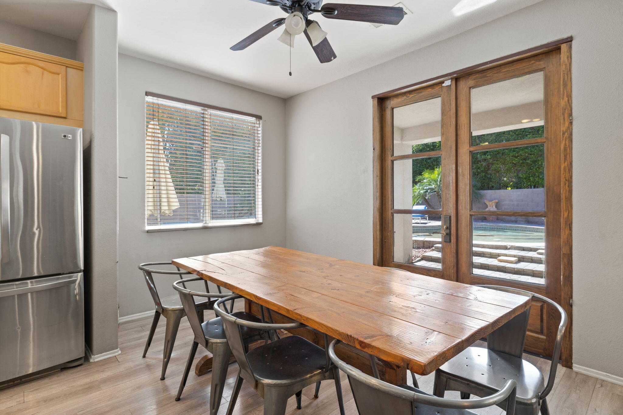 80759 Avery Drive Indio, CA 92201 - Photo 14 of 70 a view of a dining room with furniture window and wooden floor