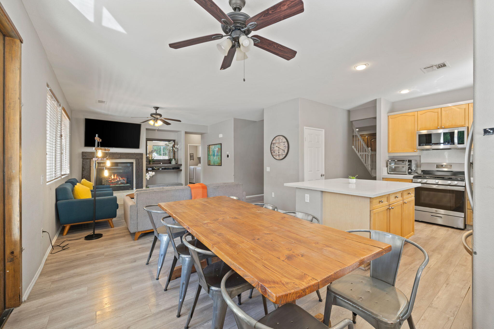 80759 Avery Drive Indio, CA 92201 - Photo 17 of 70 a kitchen with stainless steel appliances kitchen island granite countertop a dining table chairs and a refrigerator