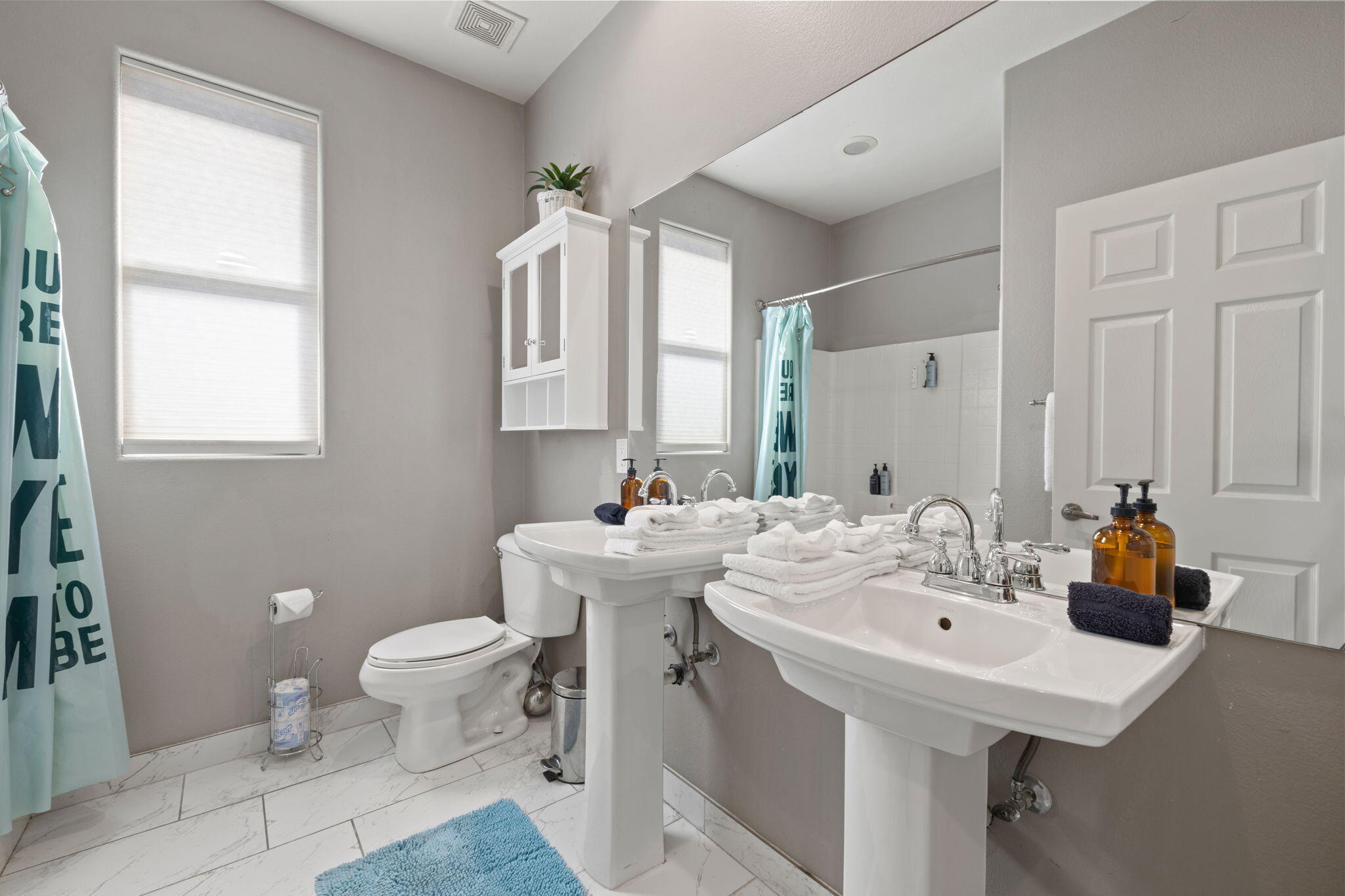 80759 Avery Drive Indio, CA 92201 - Photo 34 of 70 a bathroom with a sink toilet and mirror