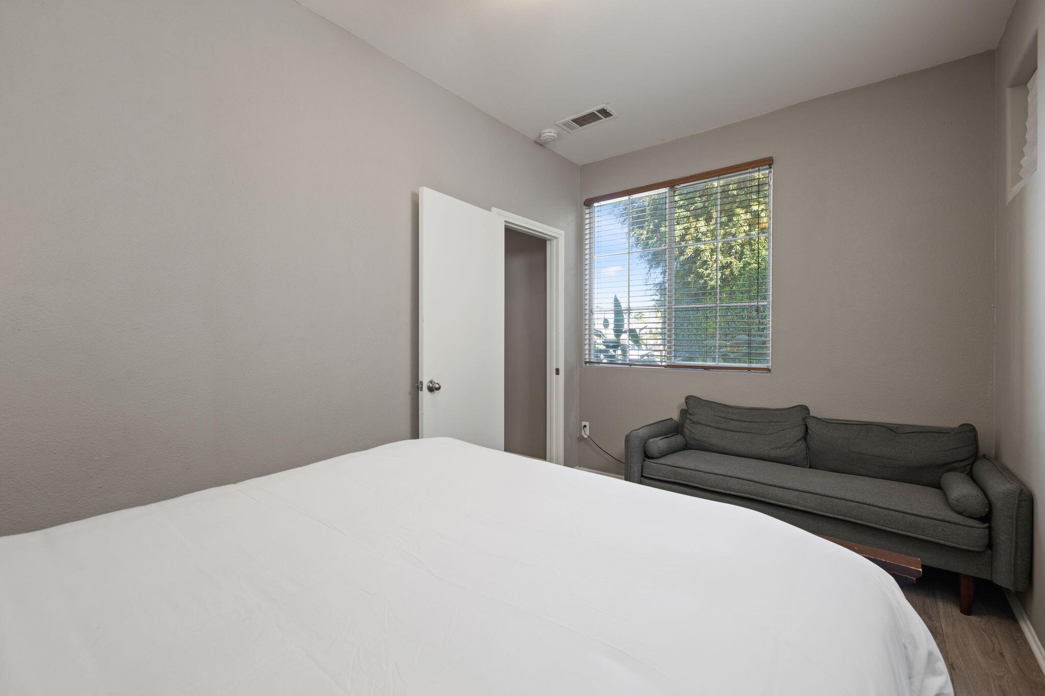 80759 Avery Drive Indio, CA 92201 - Photo 44 of 70 a bedroom with a bed window and couch