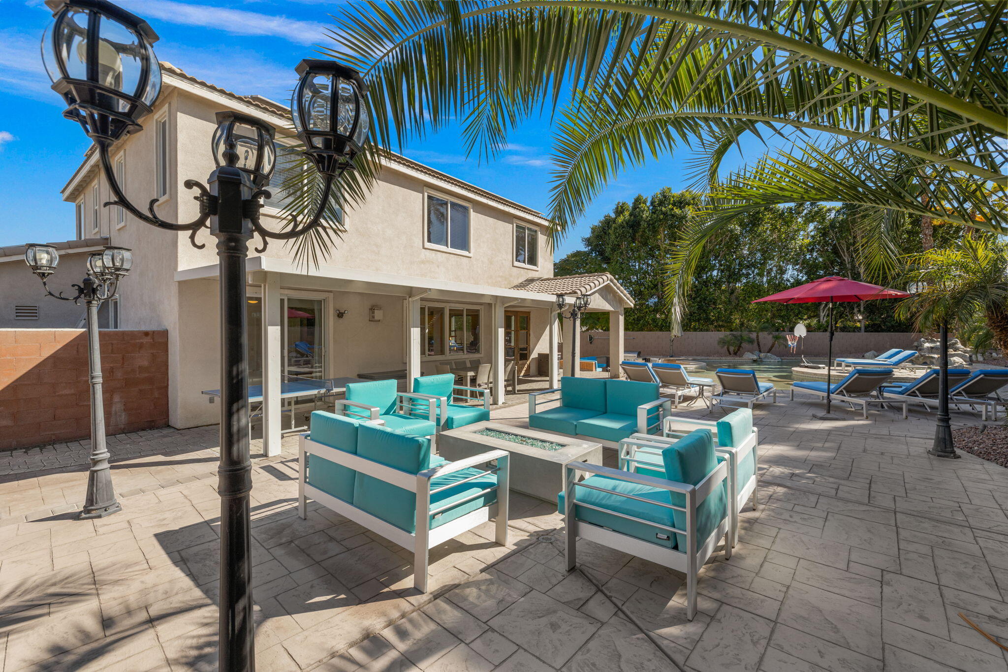 80759 Avery Drive Indio, CA 92201 - Photo 59 of 70 a view of a patio with a table and chairs under an umbrella