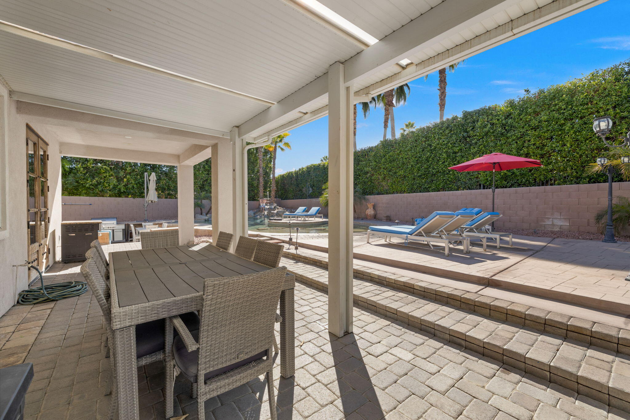 80759 Avery Drive Indio, CA 92201 - Photo 62 of 70 a view of a patio with a table and chairs under an umbrella
