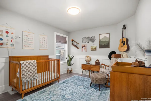 a bedroom with furniture and a window