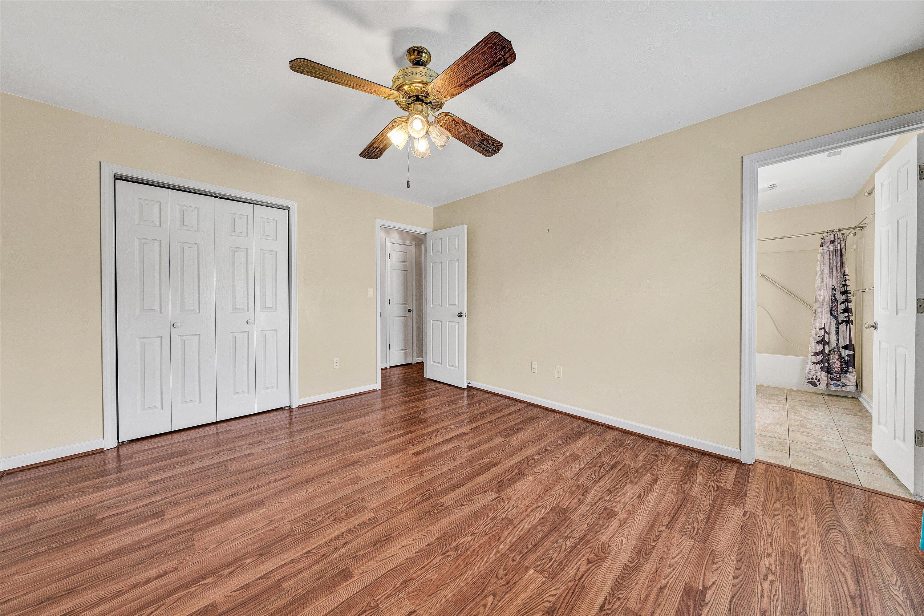 1060 Kessler Mill Road Salem, VA 24153 - Photo 15 of 31 wooden floor in an empty room with a window