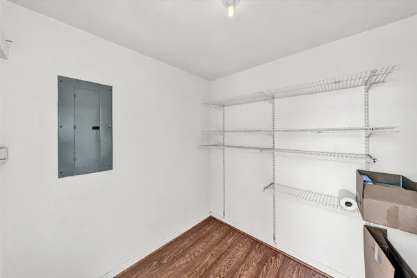 a view of a roof deck with wooden floor and fence