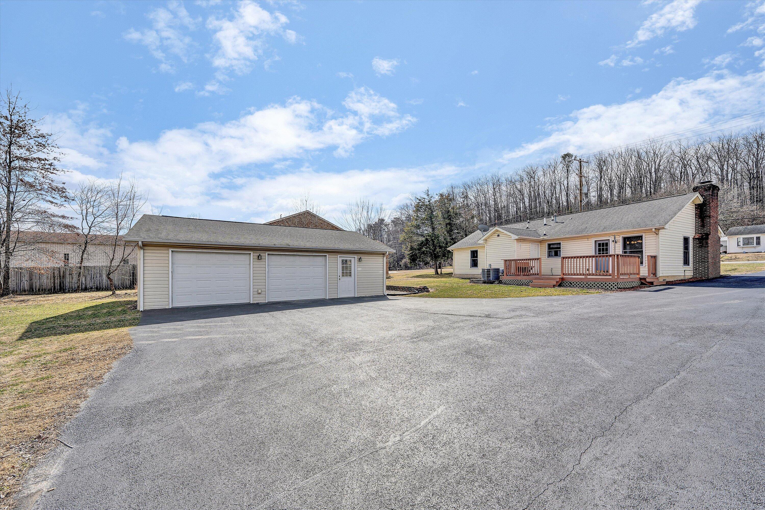 1060 Kessler Mill Road Salem, VA 24153 - Photo 21 of 31 a front view of residential houses with yard and entertaining space