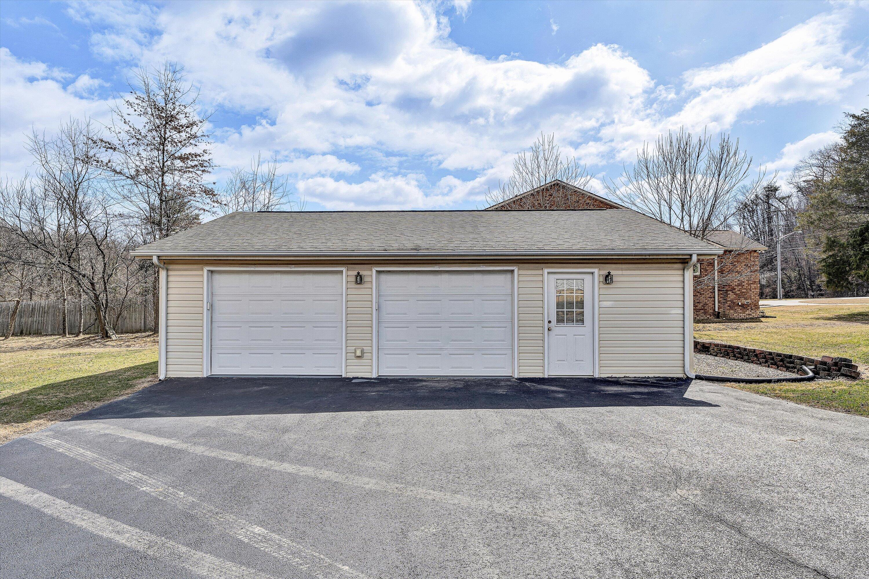1060 Kessler Mill Road Salem, VA 24153 - Photo 22 of 31 a front view of a house with a yard and garage