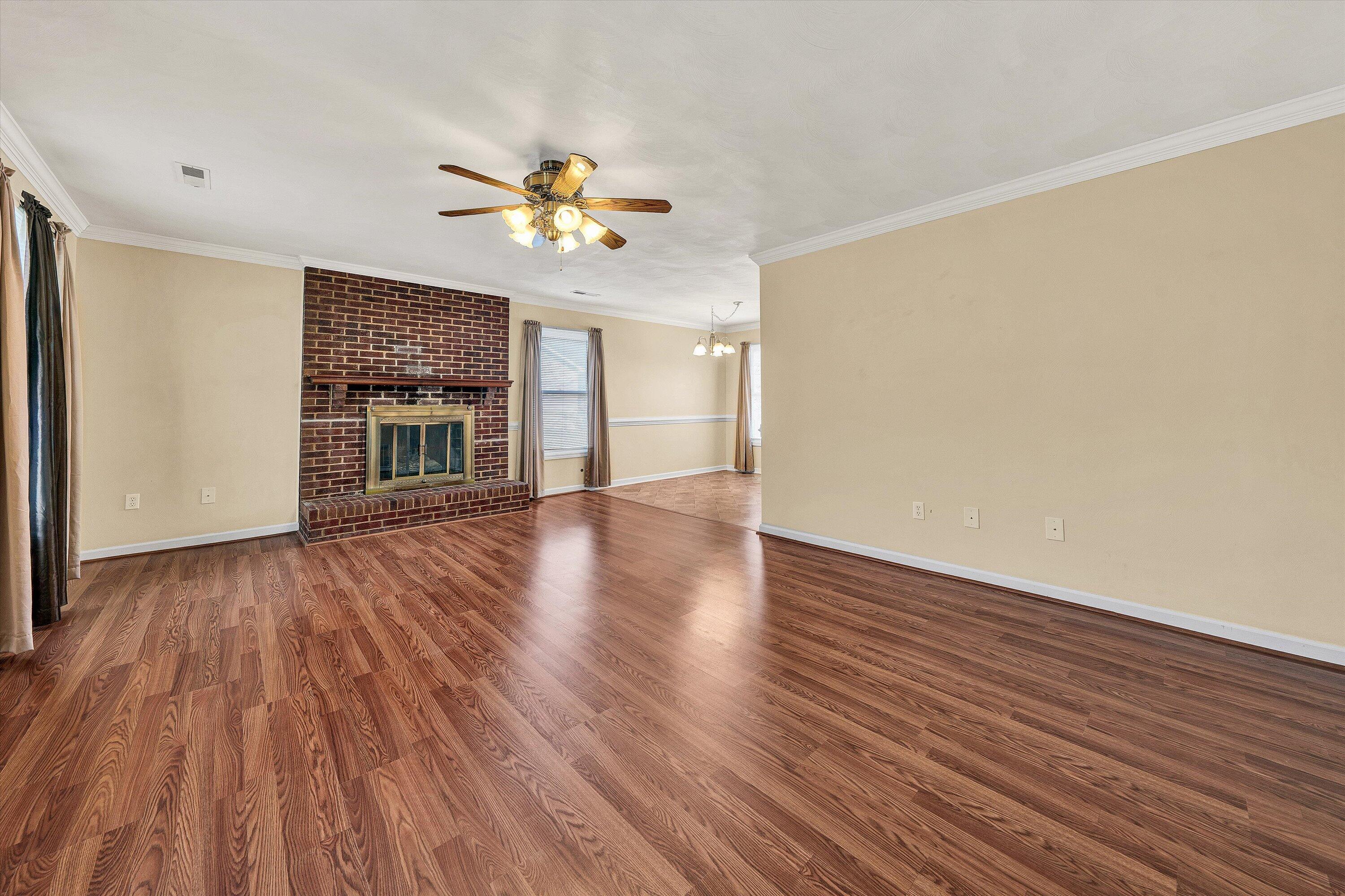 1060 Kessler Mill Road Salem, VA 24153 - Photo 2 of 31 a view of empty room with wooden floor and fan